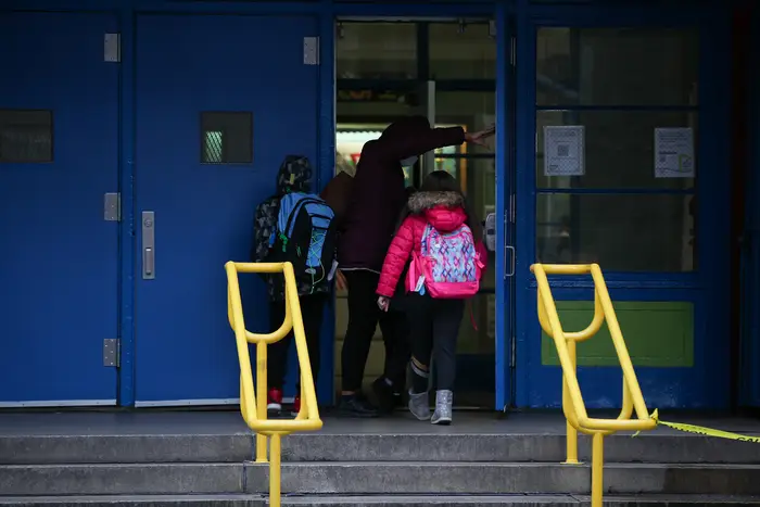 Students enter a New York City public school.